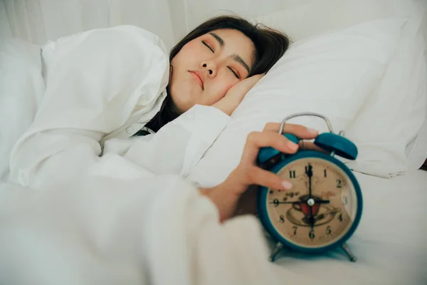 Asian Beautiful Woman White Pajamas Turning Alarm Clock While Sleepy — Stock Photo, Image