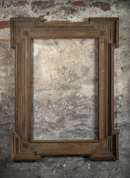 Vintage wooden frame on an old concrete wall with empty space inside