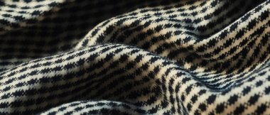 İnce köpek dişi deseni klasik ve sofistike bir dokuyu yumuşak tonlarda gösterir.