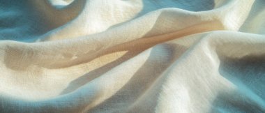 Yumuşak ve doğal keten kumaş dokusu zarif tasarımlar ve afişler için boş bir alan sağlıyor.