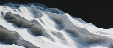 Yumuşak kum tepeleri, yumuşak ışık ve gölgelerle yıkanmış sakin bir manzara yaratır..