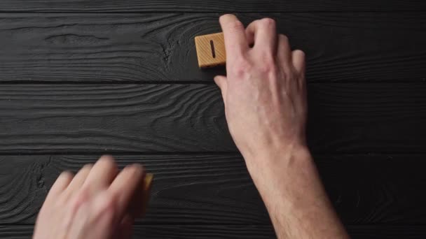 Male Hands Collect Phrase Love You Wooden Cubes Black Background — Vídeo de stock