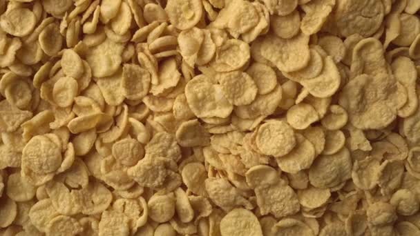 Yellow Corn Flakes Form Slowly Rotating Textured Background Concept Healthy — Stock Video