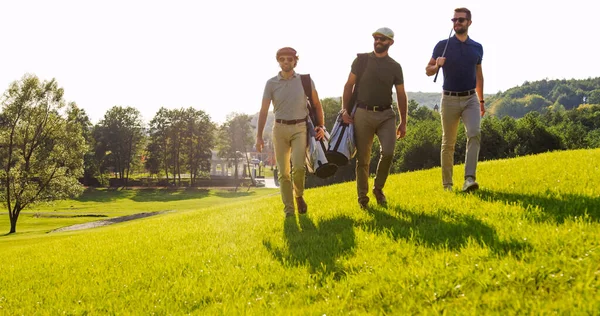 View Three Handsome Male Friends Sunglasses Strolling Clubs Golf Bags — Foto Stock