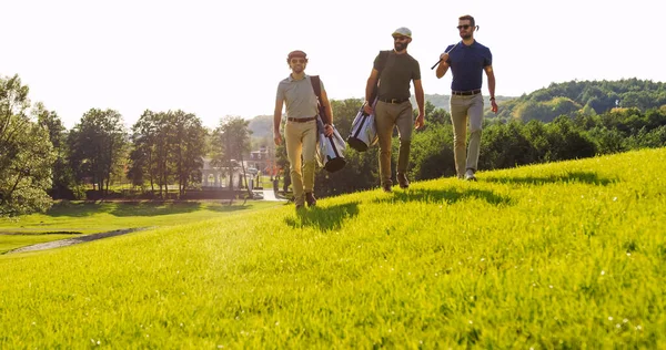 Three Handsome Male Friends Sunglasses Strolling Clubs Golf Bags — Foto Stock