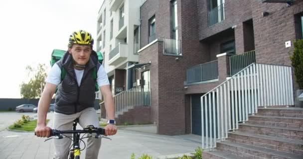 Caucasian Male Courier Riding Bicycle While Delivering Food Client House — Stock Video