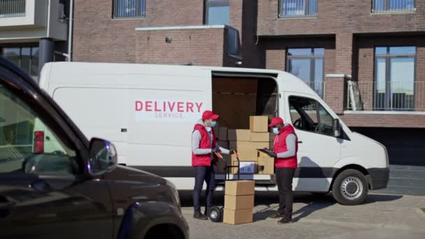 Delivery Men Standing Front Van Checking Parcel Box Delivering Recipient — Stock Video