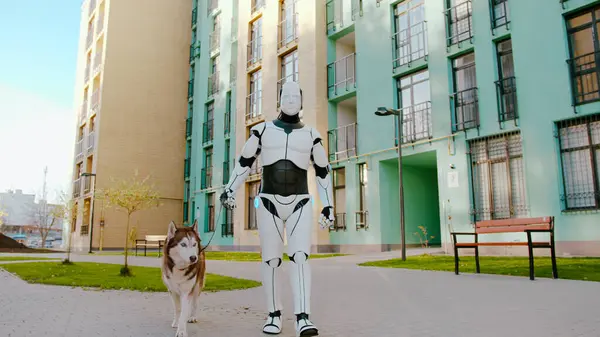 White humanoid robot walking husky dog with leash on residential complex area. Smart machine replacing human labor. Future concept of artificial intelligence.
