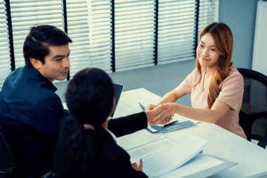 A new and competent female employee successfully interviewed. Newly graduated gets her first job after the interview.