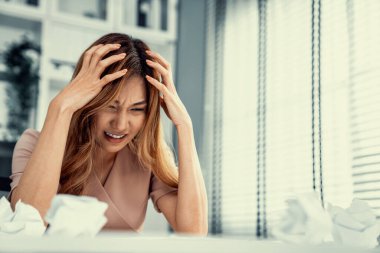 A competent female employee who has become completely exhausted as a result of overburdened work. Concept of unhealthy life as an office worker, office syndrome.