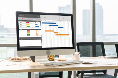 Project planning software for modish business project management on the computer screen showing timeline chart of the team project clipart