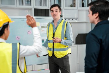 A team of investor and competent engineers brainstorming on the whiteboard to find new ideas and making plans. The idea of a team gather ideas together.