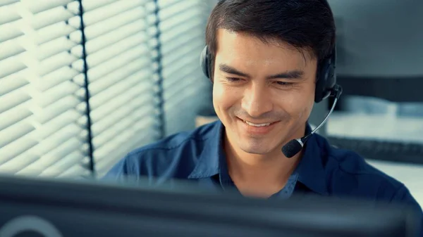 Young Competent Asian Male Call Center Agent Working His Computer — Foto de Stock