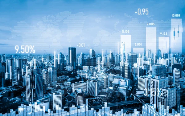 As background for a financial or business concept, digital screen and financial graphs overlap on a picture of modernistic cityscape, skyscrabbers.