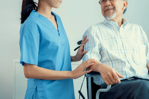 Happy Positive Asian Nurse Giving Support Touching Contented Senior Man —  Fotos de Stock