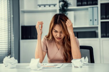 A competent female employee who has become completely exhausted as a result of overburdened work. Concept of unhealthy life as an office worker, office syndrome.