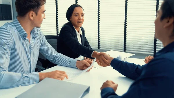 stock image Commercial contract signed by competent people of various ethnicities and shake hands. Trade agreements, two-party business transactions.