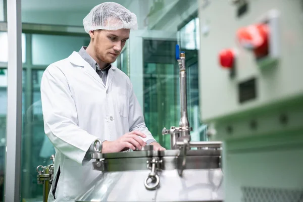 stock image Portrait of a scientist, apothecary extracting cannabis oil using scientific equipment in a laboratory. Concept of cannabis extraction for alternative medicinal treatment