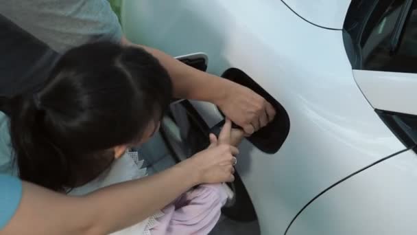 Progressive Parents Electric Vehicle Home Charging Station Happy Family Daughter — Stock Video