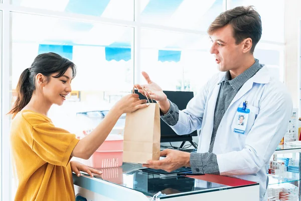Affable Pharmacist Give Handing Customer Bag Qualified Medications Medical Supplies — Stock Photo, Image