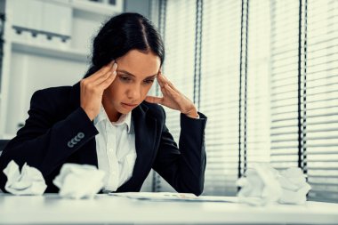 A competent female employee who has become completely exhausted as a result of overburdened work. Concept of unhealthy life as an office worker, office syndrome, effect from overwork.