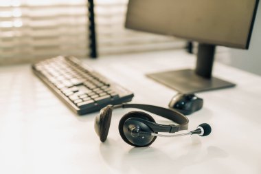 Essential equipment concept for competent online operators, call service agents, or online working. Customer service equipment, as well as helpdesk tools.