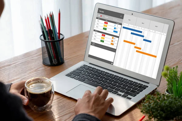 stock image Project planning software for modish business project management on the computer screen showing timeline chart of the team project