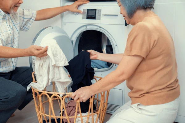 Senior Couple Working Together Complete Household Chores Washing Machine Happy — Stockfoto