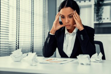 A competent female employee who has become completely exhausted as a result of overburdened work. Concept of unhealthy life as an office worker, office syndrome, effect from overwork.