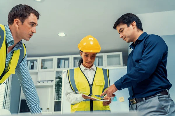 Team Competent Engineers Wearing Safety Equipment Working Blueprints Tablet While — Stockfoto