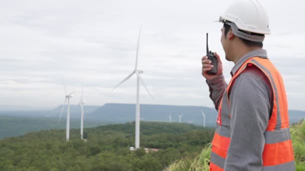 Engineer Working Wind Farm Atop Hill Mountain Rural Progressive Ideal — Stock Video