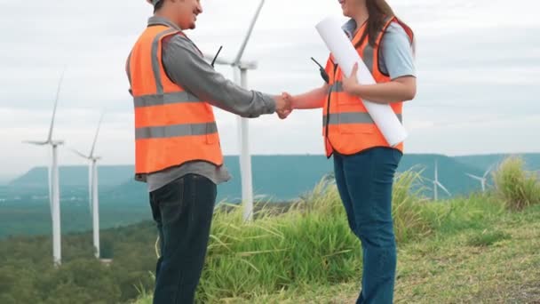 Male Female Engineers Working Wind Farm Atop Hill Mountain Rural — Stock Video