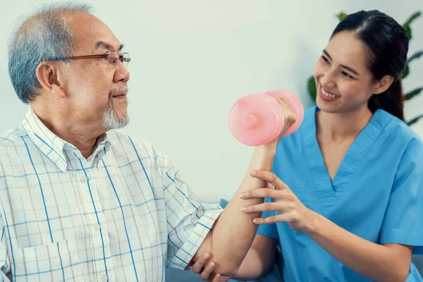 Contented Senior Patient Doing Physical Therapy Help His Caregiver Senior — 스톡 사진