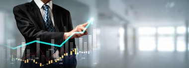Businessman analyst working with digital finance business data graph showing technology of investment strategy for perceptive financial business decision. Digital economic analysis technology concept.