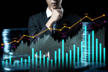 Businessman analyst working with digital finance business data graph showing technology of investment strategy for perceptive financial business decision. Digital economic analysis technology concept.