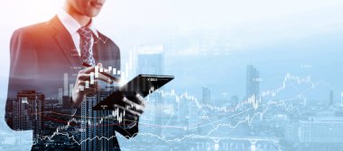Businessman analyst working with digital finance business data graph showing technology of investment strategy for perceptive financial business decision. Digital economic analysis technology concept.