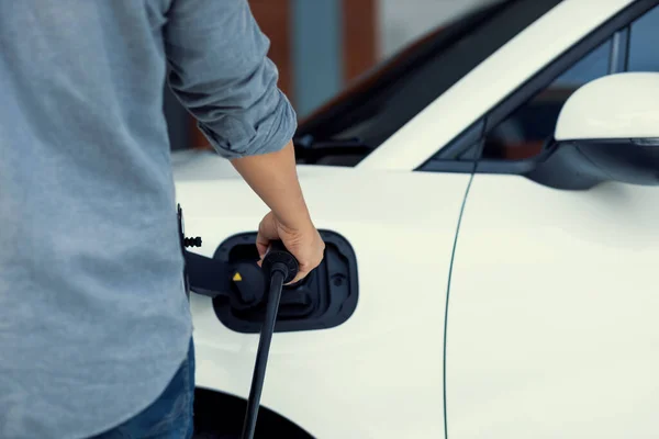Closeup Progressive Asian Man Install Cable Plug His Electric Car — Foto Stock