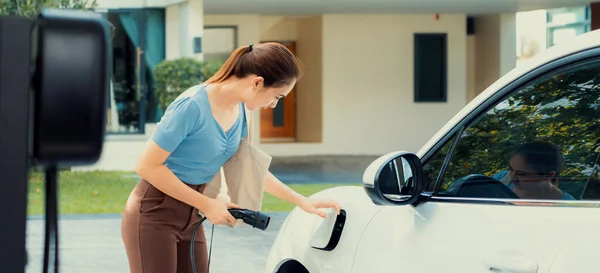 Progressive Woman Install Cable Plug Her Electric Car Home Charging — Foto Stock