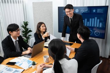 Businesspeople shake hand after successful agreement or meeting. Office worker colleague handshake with business team leader manager for strong teamwork in office to promote harmony and unity concept.