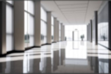 Blur background of empty entrance hall of modern public station or large convention center lobby . Contemporary beautiful office hallway with bright and clean composition