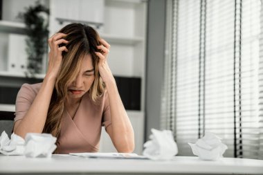 A competent female employee who has become completely exhausted as a result of overburdened work. Concept of unhealthy life as an office worker, office syndrome.