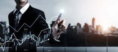 Businessman analyst working with digital finance business data graph showing technology of investment strategy for perceptive financial business decision. Digital economic analysis technology concept.