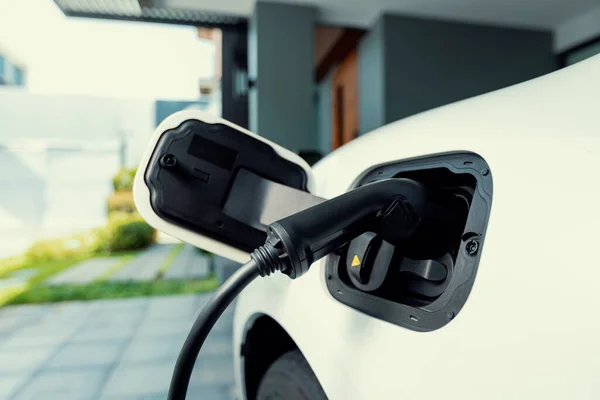 Closeup Electric Vehicle Plugged Cable Charging Point Powered Progressive Concept — Stok fotoğraf