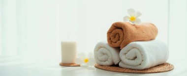 Spa accessory composition set in day spa hotel , beauty wellness center . Spa product are placed in luxury spa resort room , ready for massage therapy from professional service .