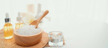 Spa accessory composition set in day spa hotel , beauty wellness center . Spa product are placed in luxury spa resort room , ready for massage therapy from professional service .