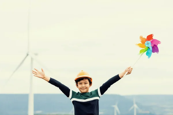 Progressive Young Asian Boy Playing Wind Pinwheel Toy Wind Turbine — Zdjęcie stockowe