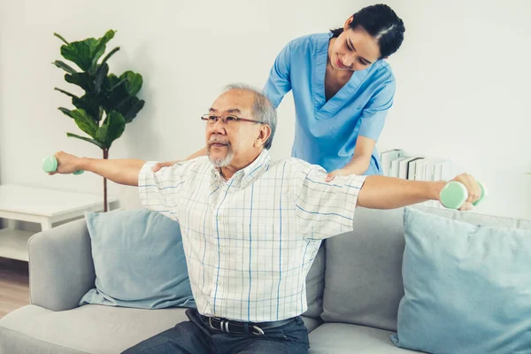Contented Senior Patient Doing Physical Therapy Help His Caregiver Senior — Foto Stock