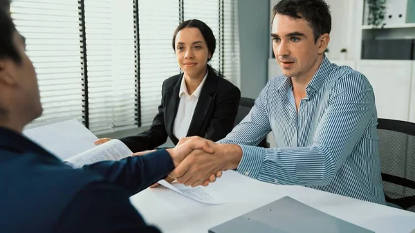 stock image Commercial contract signed by competent people of various ethnicities and shake hands. Trade agreements, two-party business transactions.