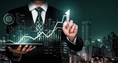 Businessman analyst working with digital finance business data graph showing technology of investment strategy for perceptive financial business decision. Digital economic analysis technology concept.