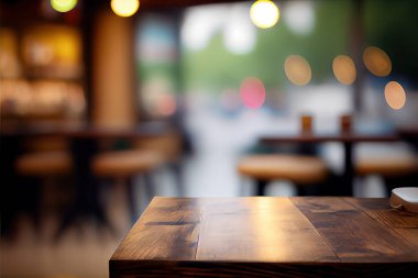 Empty wood table for product display in blur background of admirable restaurant at night